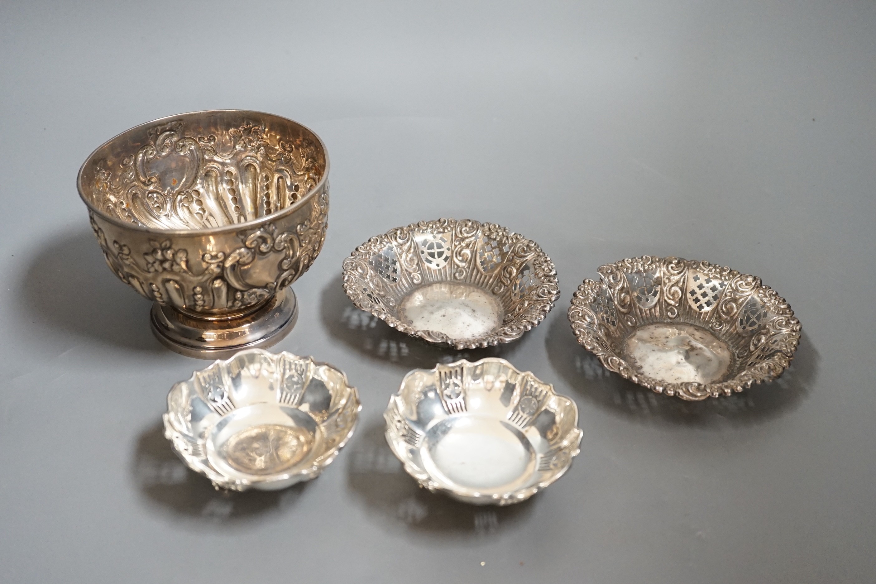 A late 19th/early 20th century repousse silver rose bowl, marks rubbed, diameter 12.6cm and two pairs of silver bonbon dishes.